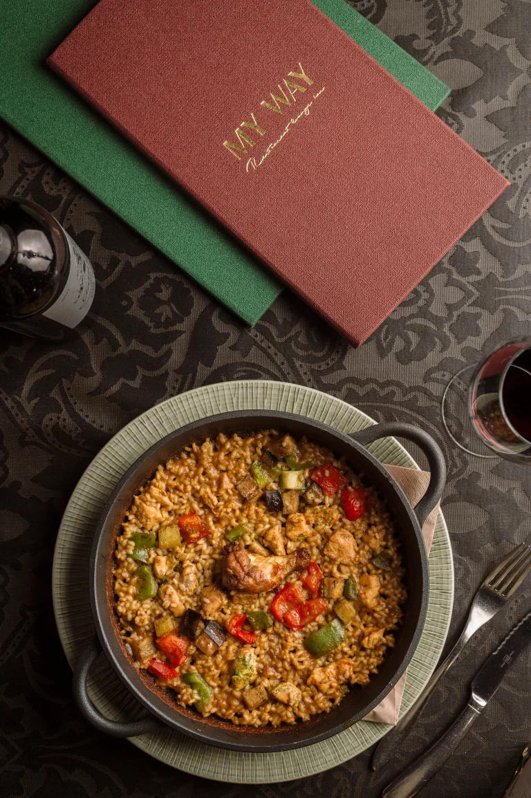 Chicken and vegetable paella served in a Mediterranean restaurant in Barcelona